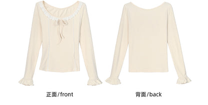 Aprikosenfarbenes, langärmliges Oberteil mit Spitzenbesatz und Schleifendetails