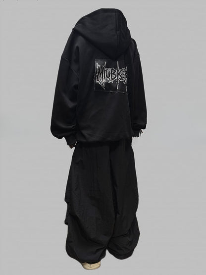 Schwarze Jacke mit Zweiwege-Knopfleiste und Reißverschluss