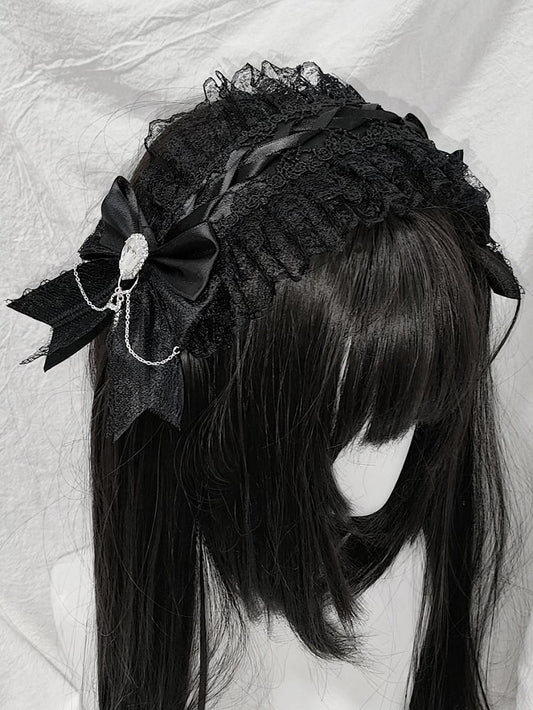 Bandeau de cheveux en dentelle noire avec nœud et strass croisés