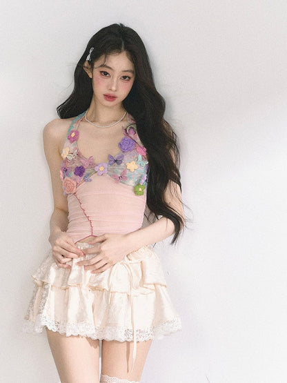 花柄装飾のピンクのレタス裾トップス ニット ホルターネック