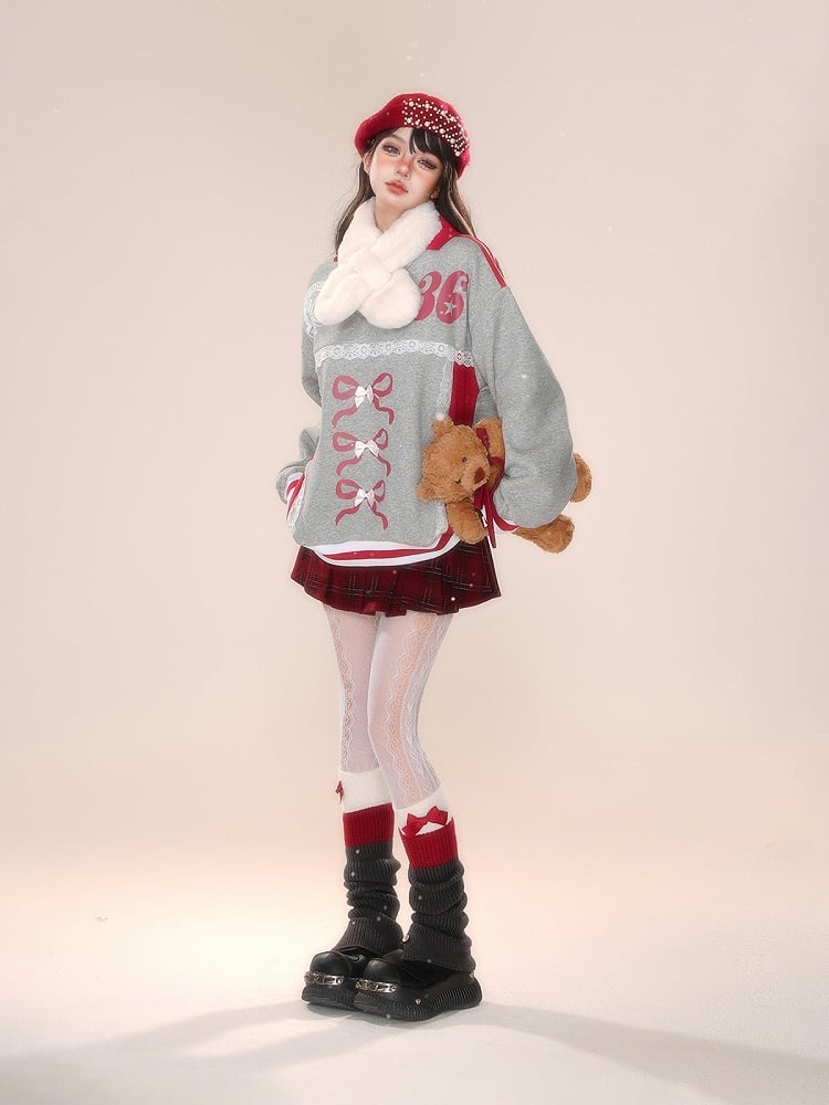 Blokette Core Sweatshirt mit V-Ausschnitt, Schleife und Zahlendruck