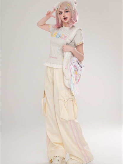 Hose mit floralen Schleifendetails und geradem Bein mit apricot/schwarzen Streifen und