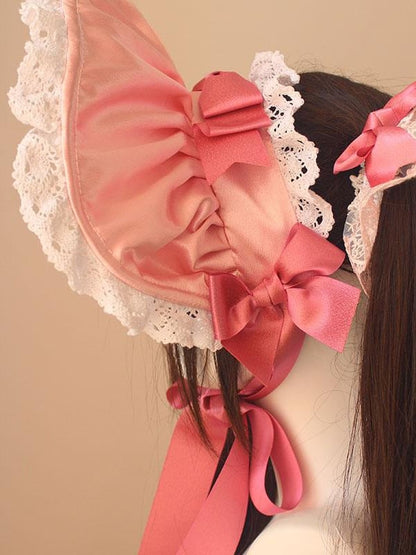コットンの蝶結びディテール、レーストリムのボンネット
