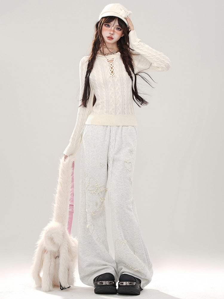 Grauer Slim-Fit-Pullover mit Rundhalsausschnitt und Cut-Out-Detail