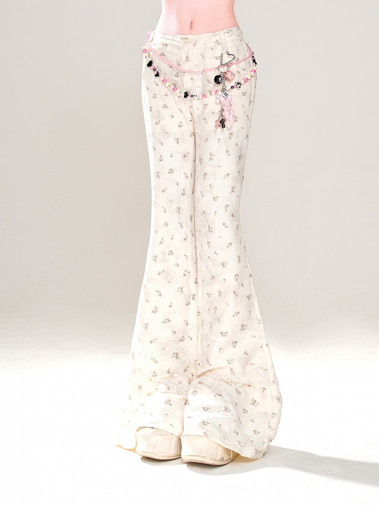 Aprikosenfarbene, schmal geschnittene Schlaghose mit niedriger Taille und Blumenmuster