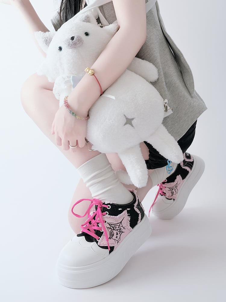 Schwarze und rosa Plateau-Sneaker mit Stern-Applikation