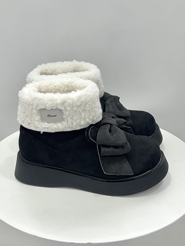 Schwarze Winterstiefel mit Plateausohle und Schleife im Hasenohren-Design