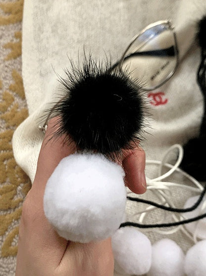 黒/白の水玉模様のポンポン付きタイツ