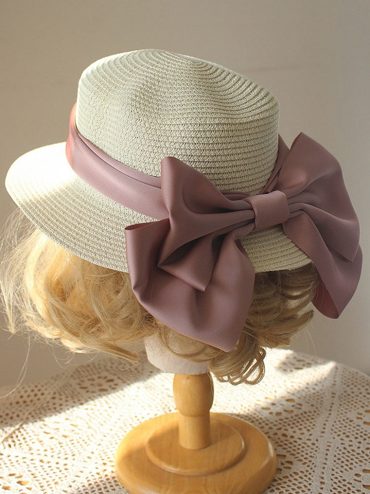 Strohhut mit großer Schleife