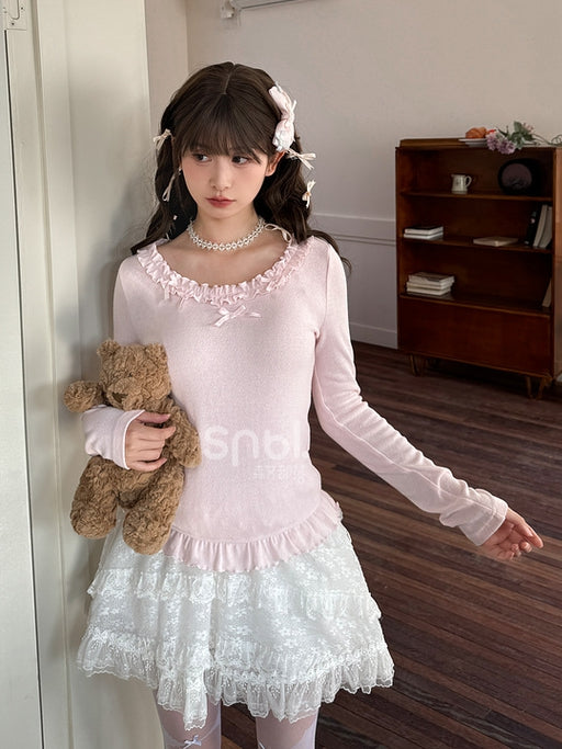 Rosafarbenes, langärmliges Oberteil mit Rüschenbesatz und Schleifendetails