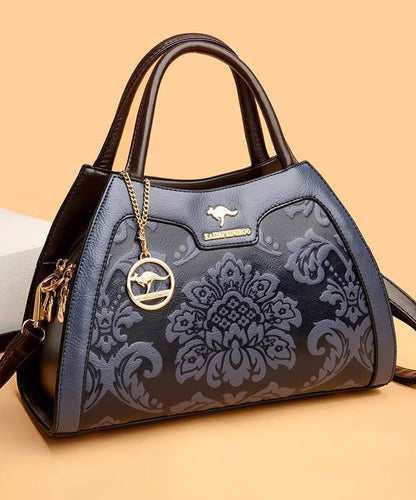 Elegante Kalbsleder-Tragetasche in Rot mit Prägung