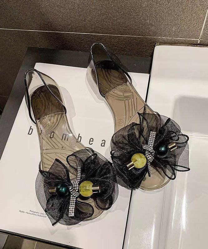 Transparente, gespleißte Zehenpartie, modische schwarze Peep-Bogen-Sandalen