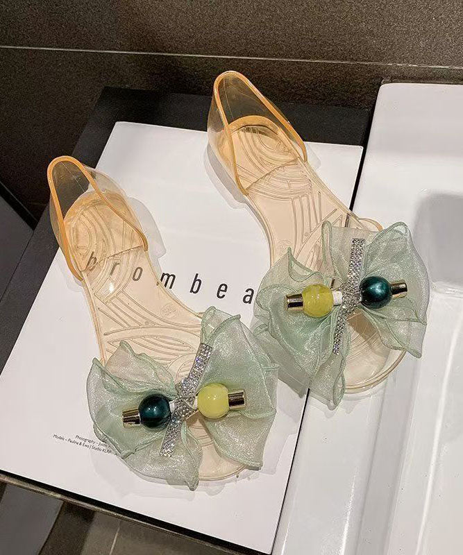 Transparente, gespleißte Zehenpartie, modische schwarze Peep-Bogen-Sandalen