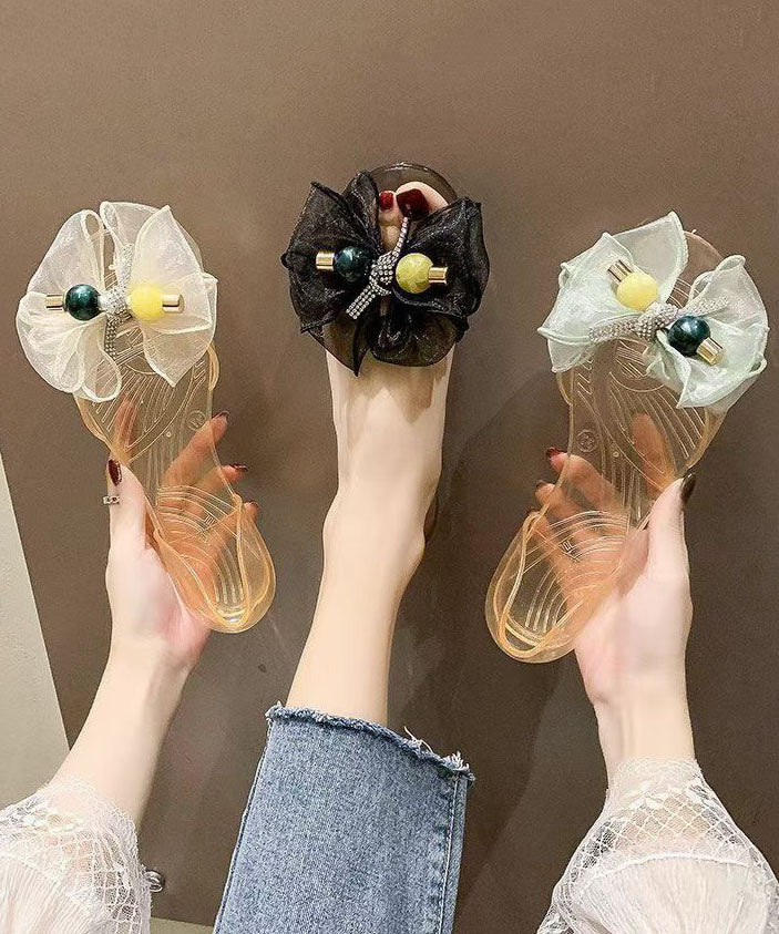 Transparente, gespleißte Zehenpartie, modische schwarze Peep-Bogen-Sandalen