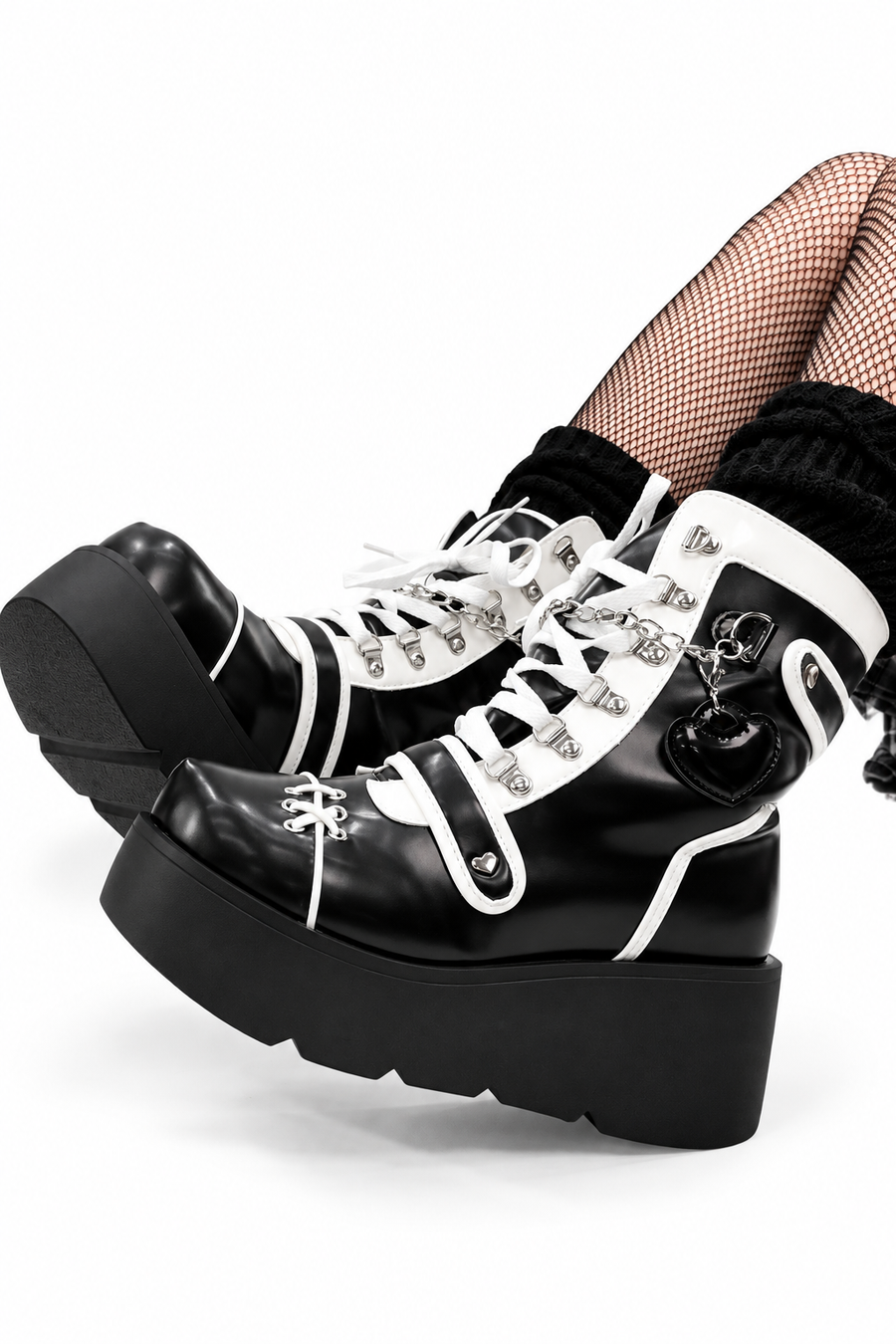 Side styling of chunky black-and-white lace-up boots