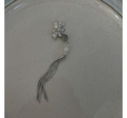 Manschetten-Ohrring mit Fransen aus Acryl mit Blume