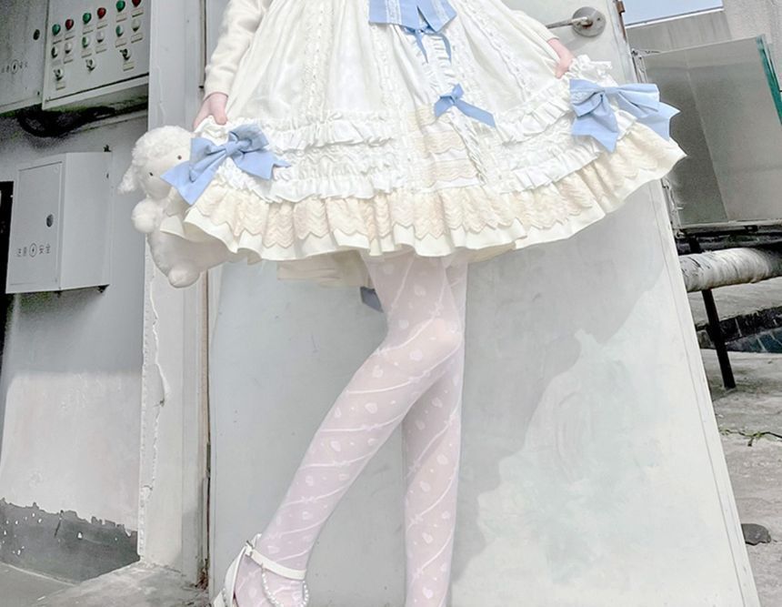 Strumpfhose mit Schleifenmuster und Herzen