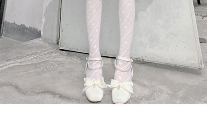 Strumpfhose mit Schleifenmuster und Herzen