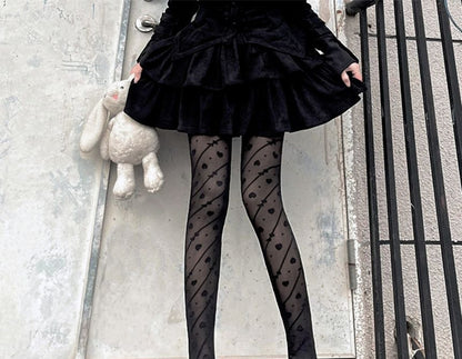 Strumpfhose mit Schleifenmuster und Herzen