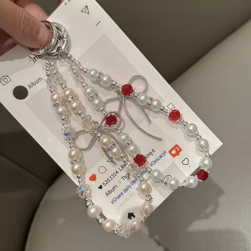 Schleifenpad mit Kunstperlen und Handy-Lanyard