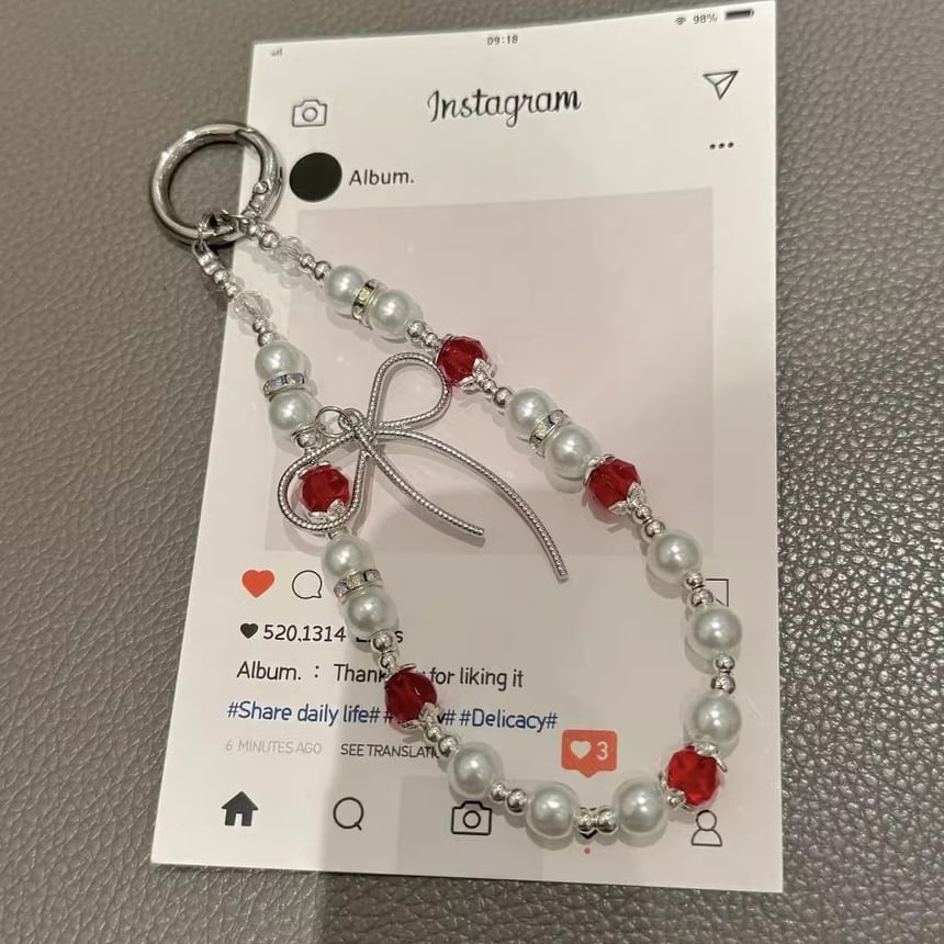 Schleifenpad mit Kunstperlen und Handy-Lanyard