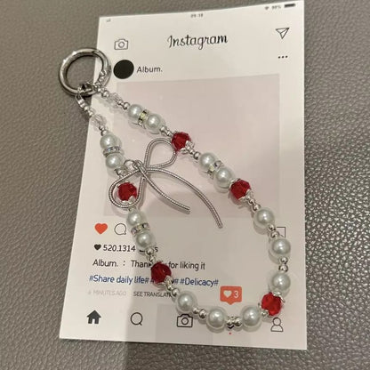 Schleifenpad mit Kunstperlen und Handy-Lanyard