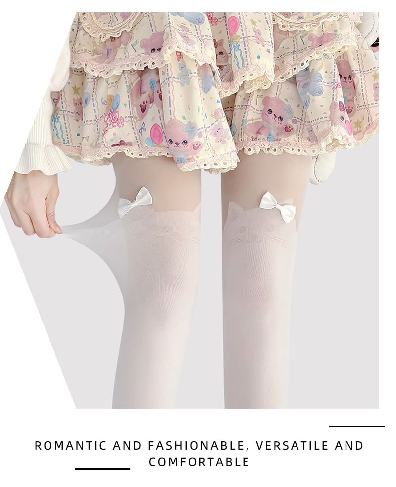 Transparente Strumpfhose mit Katzenmuster und Schleife