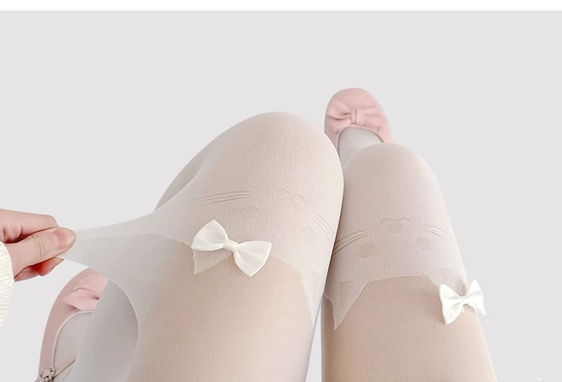 Transparente Strumpfhose mit Katzenmuster und Schleife