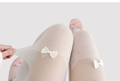 Transparente Strumpfhose mit Katzenmuster und Schleife