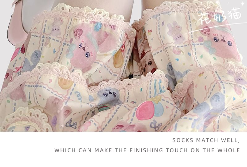 Transparente Strumpfhose mit Katzenmuster und Schleife