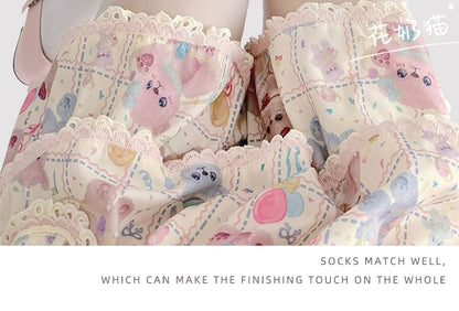 Transparente Strumpfhose mit Katzenmuster und Schleife