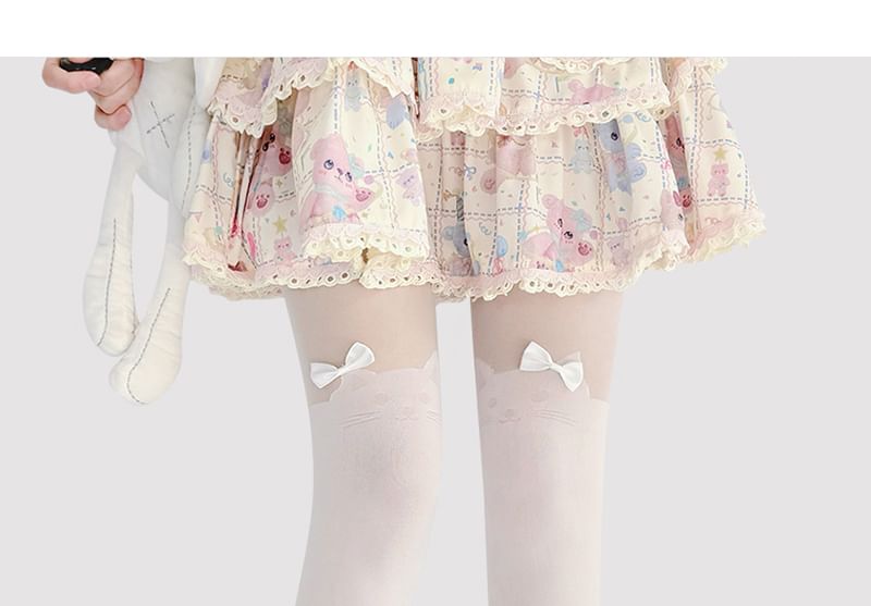 Transparente Strumpfhose mit Katzenmuster und Schleife