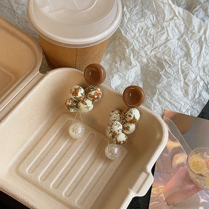 Tropfenperlen-Ohrring-Druck, Blumenstoff