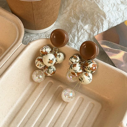 Tropfenperlen-Ohrring-Druck, Blumenstoff