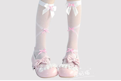 Hohe, transparente Kniestrümpfe mit Schleife