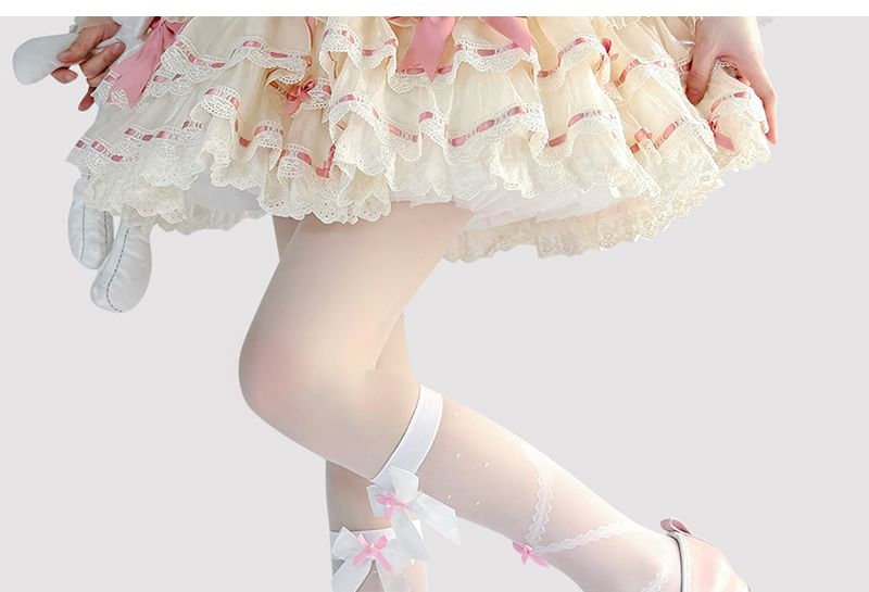 Hohe, transparente Kniestrümpfe mit Schleife