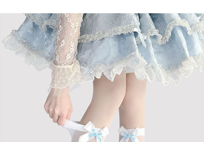 Hohe, transparente Kniestrümpfe mit Schleife