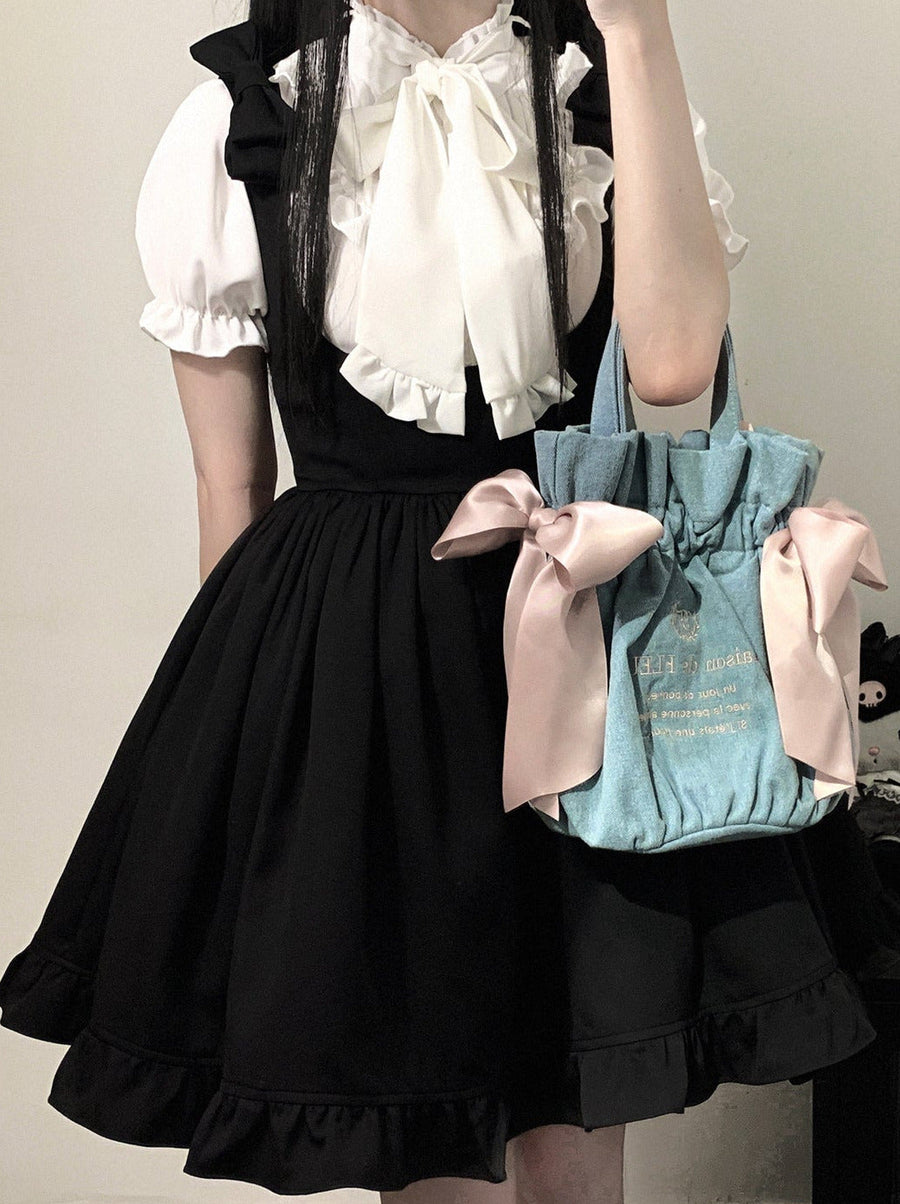 Schwarzes Trägerkleid mit Spitzenband an den Schultern