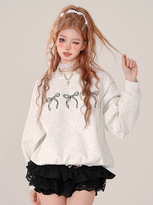 リボンがキュートなクルーネックセーター