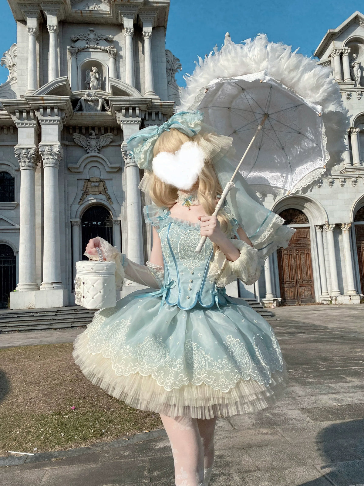 Blue-Green corset and short skirt set worn outdoors