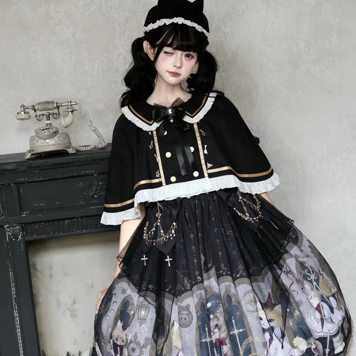Cat Choir black Gothic Lolita dress styled with white-lace cape and cat-ear headwear