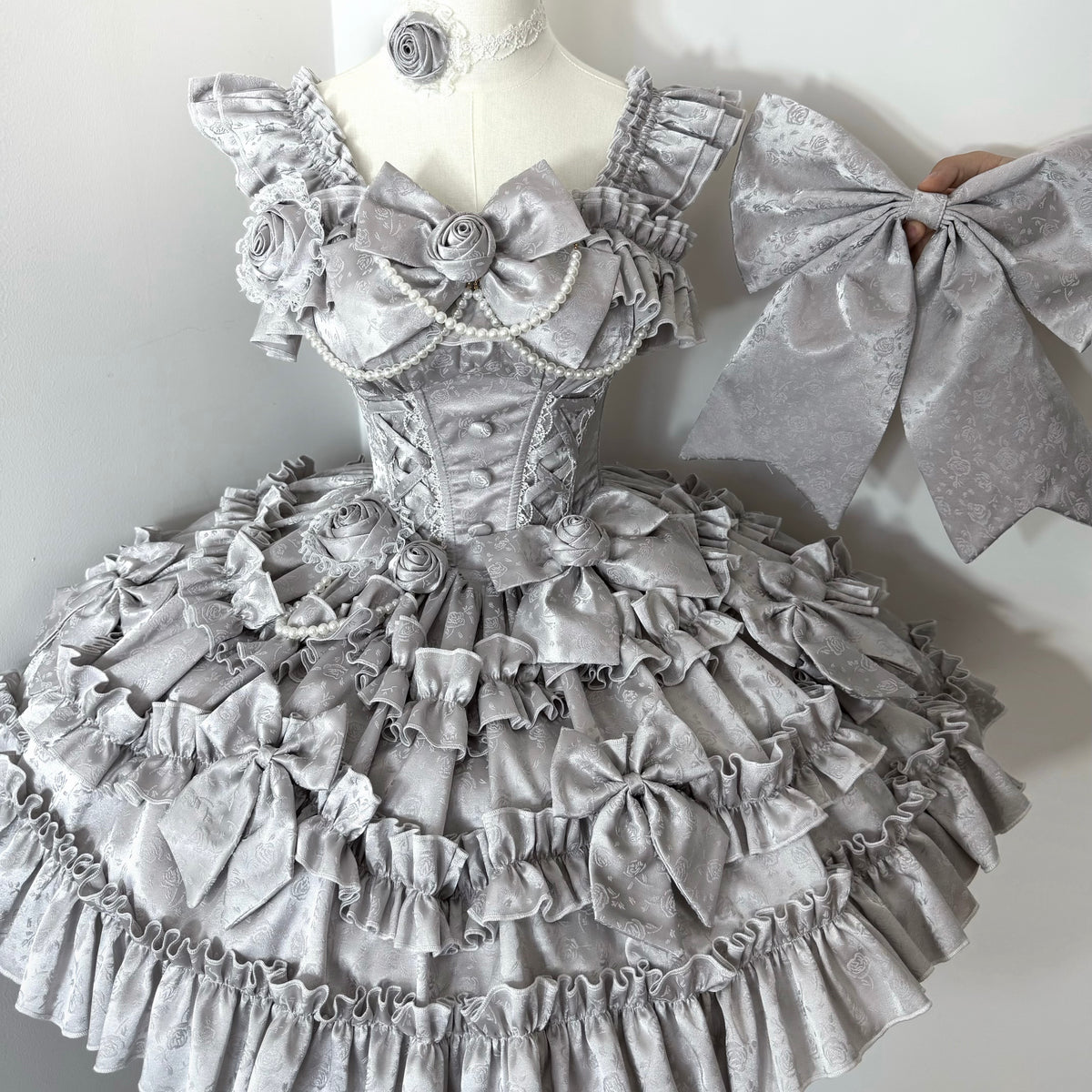 Silver jacquard ruffle dress with matching bow and layered skirt