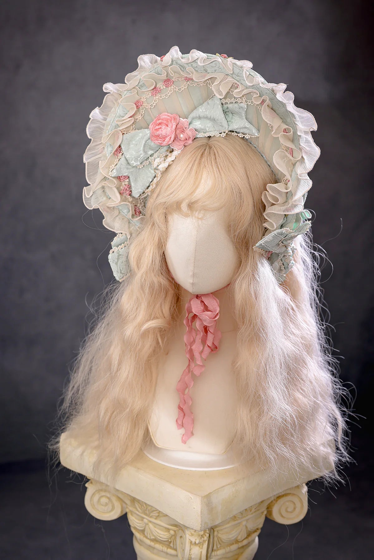Antique Cake Mint Moonlight ruffled bonnet on display by BR Thorn Rose