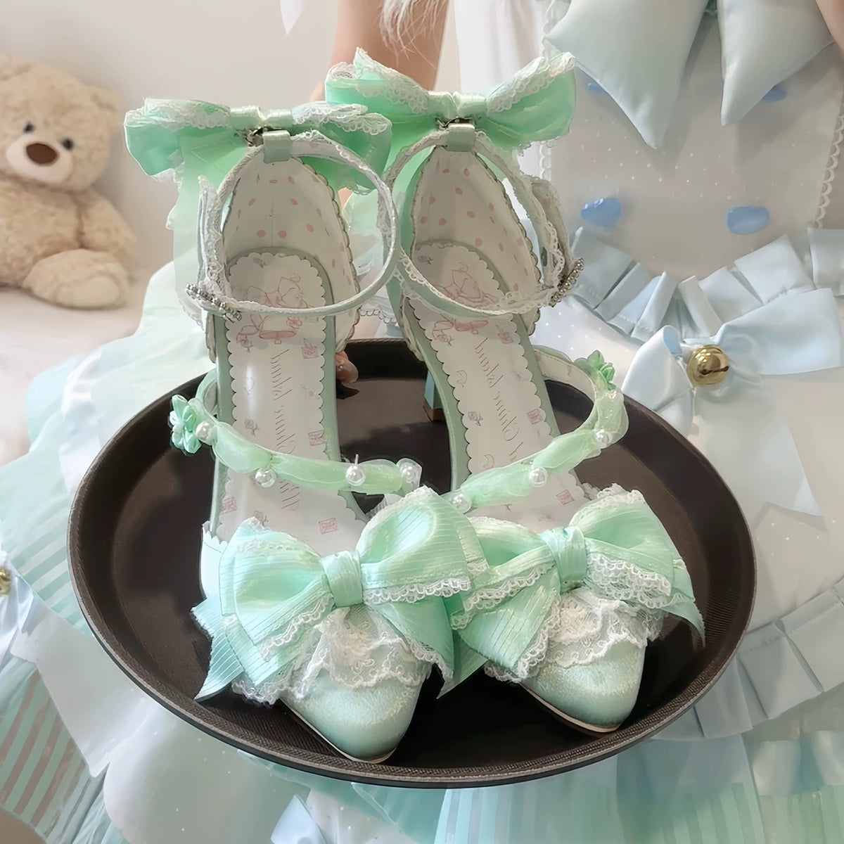 Light Green Spring Sakura heels displayed as a pair