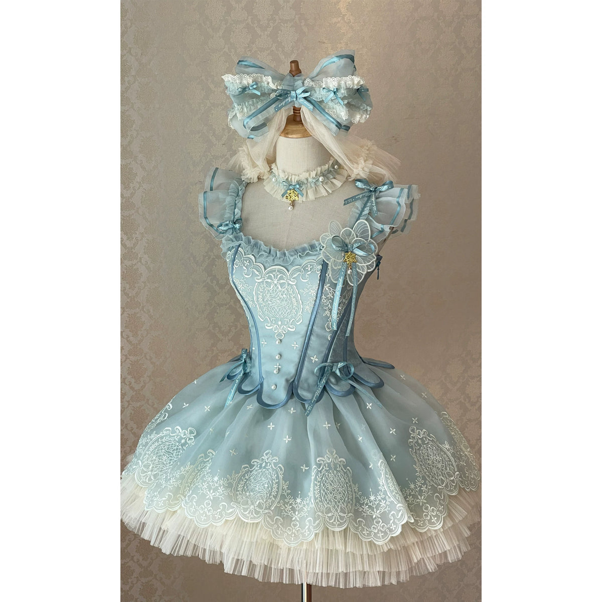 Blue-Green embroidered corset and short skirt set on a mannequin