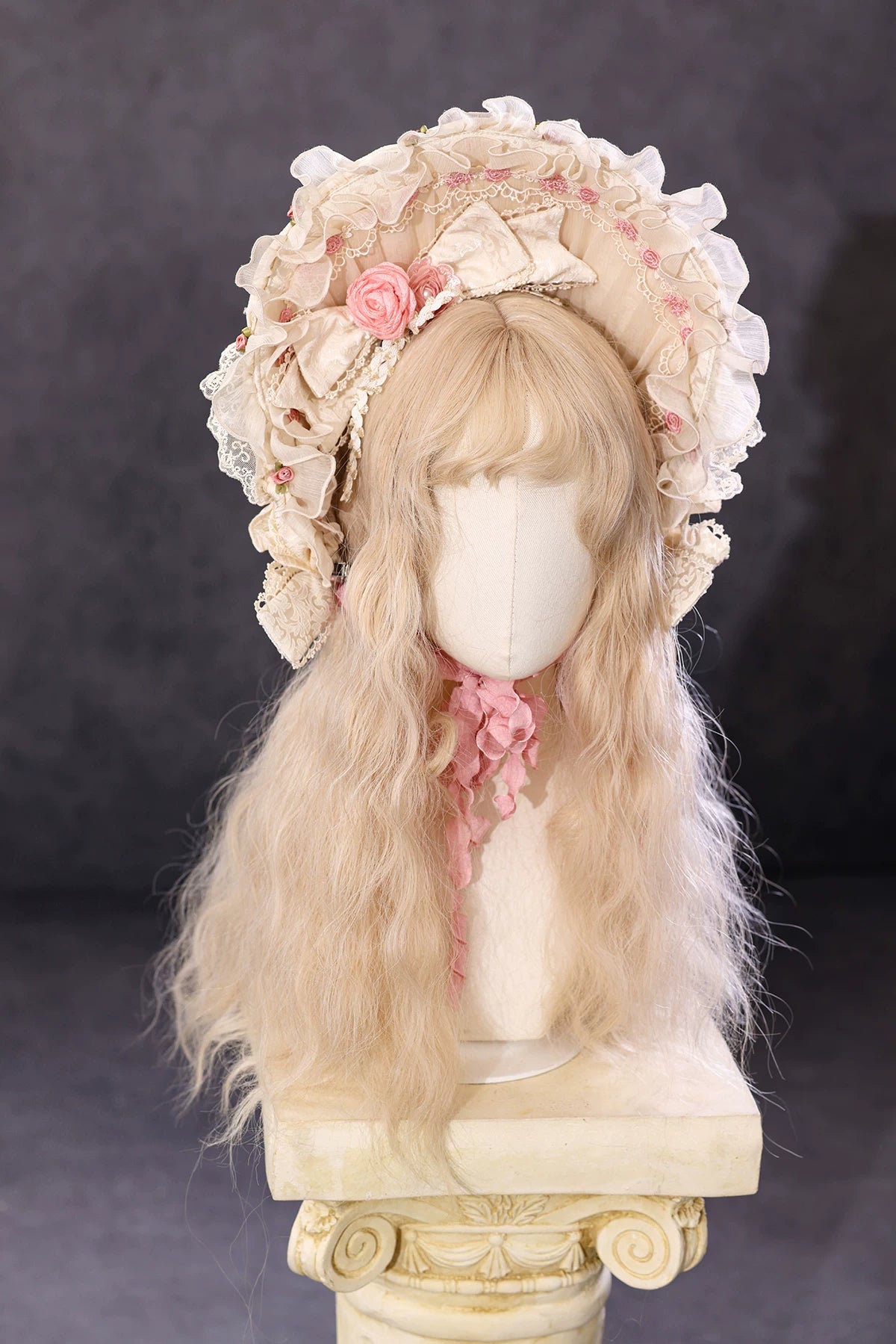 Antique Cake Pearl Shimmer ruffled bonnet on display by BR Thorn Rose