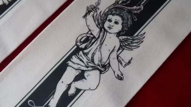 Detailed cherub print on Gothic tights fabric
