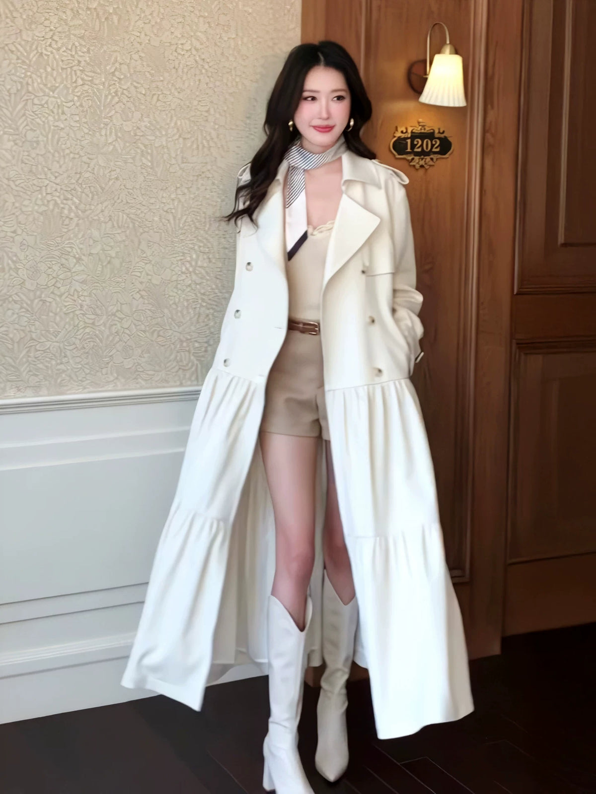 White belted double-breasted flared trench coat front view