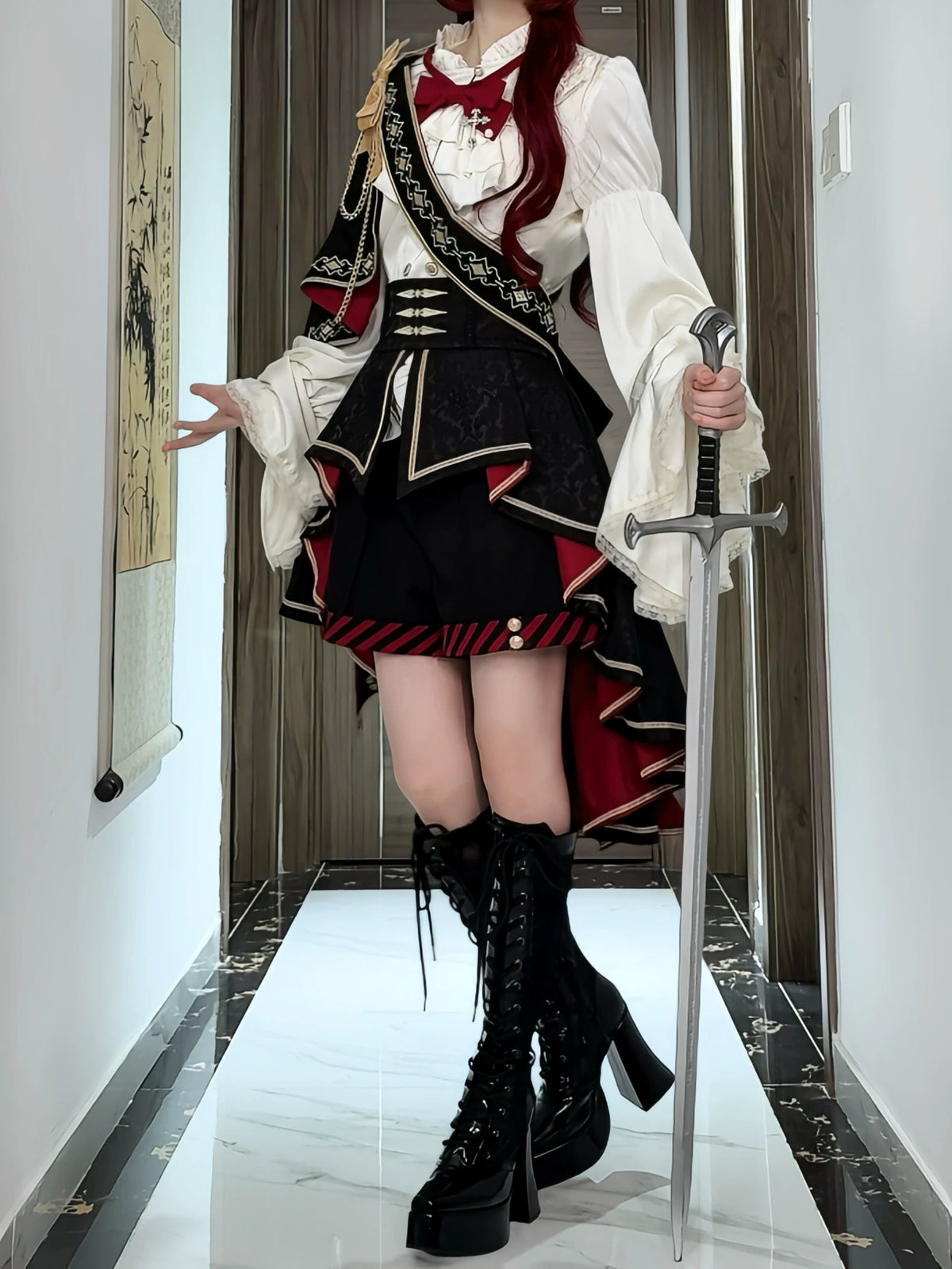 Burgundy knight outfit with decorative sash and high-low train, styled with sword prop