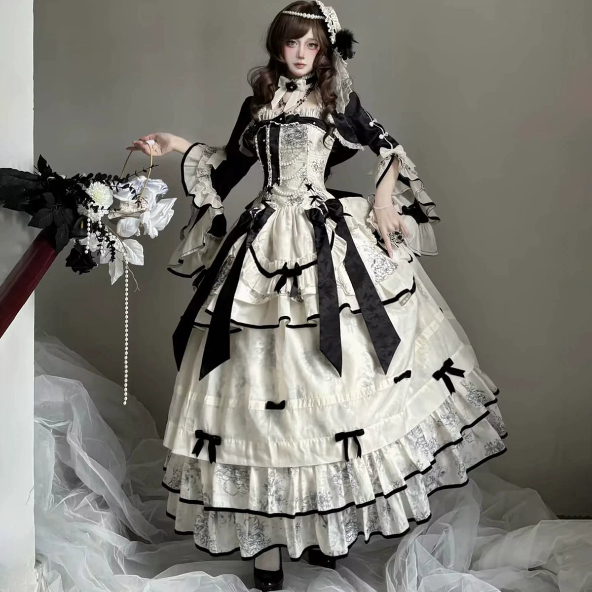 Long black and ivory dress styled with matching cardigan